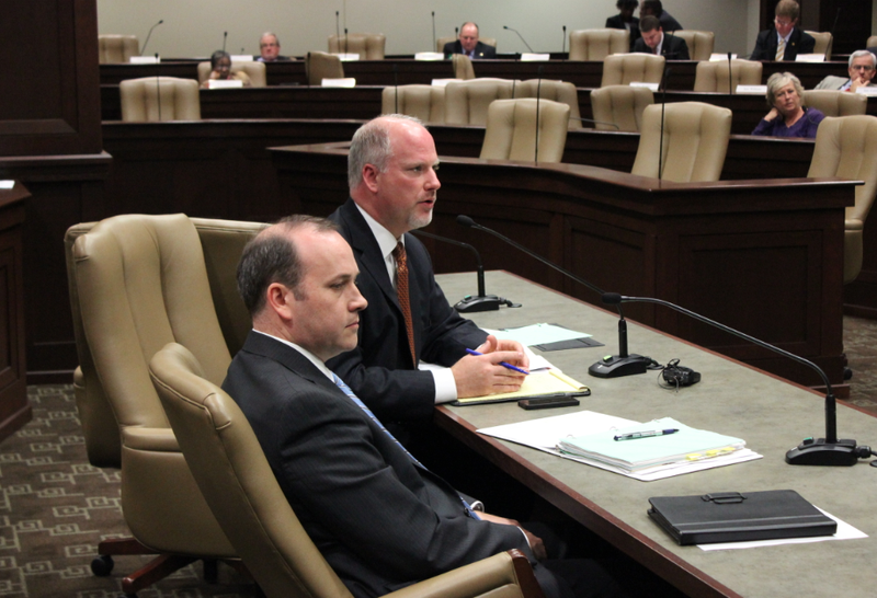 Attorney General Dustin McDaniel addresses lawmakers Friday beside Assistant Attorney General Scott Richardson.