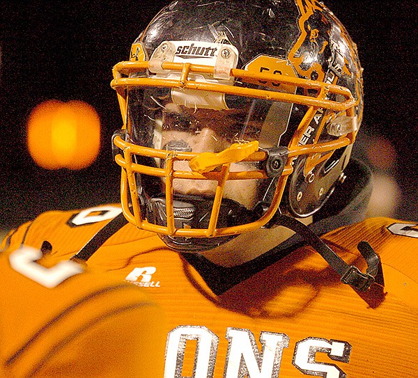 Photo by Randy Moll 
Michael Olvera visits with another player on the sidelines during play in Gravette’s Lion Stadium on Nov. 8, in the game against Prairie Grove.