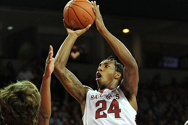 Arkansas' Michael Qualls drives to the hoop in the second half of Friday night's game against Louisiana at Bud Walton Arena in Fayetteville.