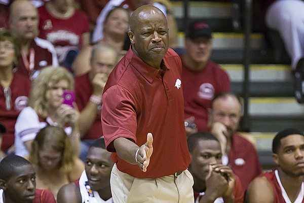 Arkansas head coach Mike Anderson gestures while giving instructions to his team in the first half of an NCAA college basketball game against California at the Maui Invitational basketball tournament on Monday, Nov. 25, 2013, in Lahaina, Hawaii. (AP Photo/Eugene Tanner)