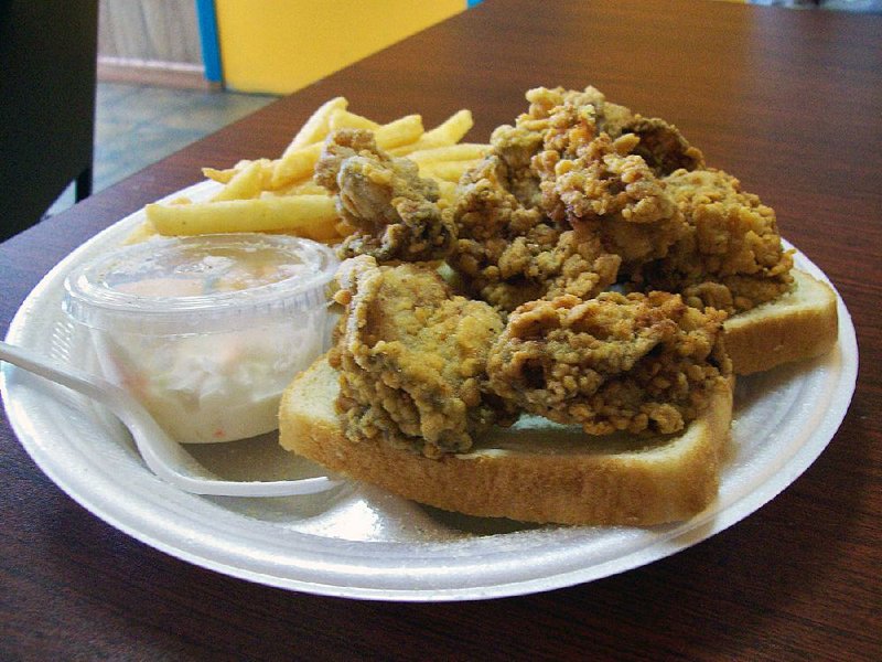 The fried oyster dinner at Sharky’s Fish & Chicken in Sherwood comes with fries, slaw and bread. 