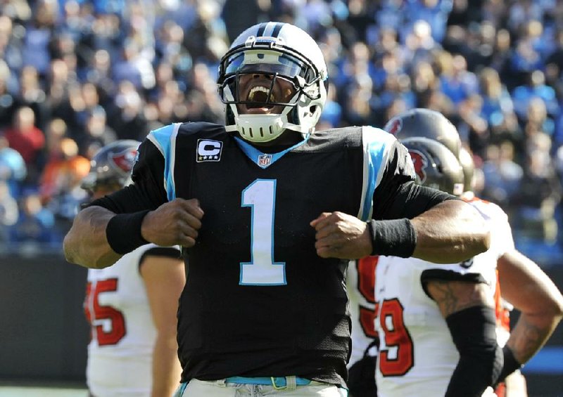 Carolina Panthers' Cam Newton (1) celebrates his touchdown pass against the Tampa Bay Buccaneers in the first half of an NFL football game in Charlotte, N.C., Sunday, Dec. 1, 2013. (AP Photo/Mike McCarn)
