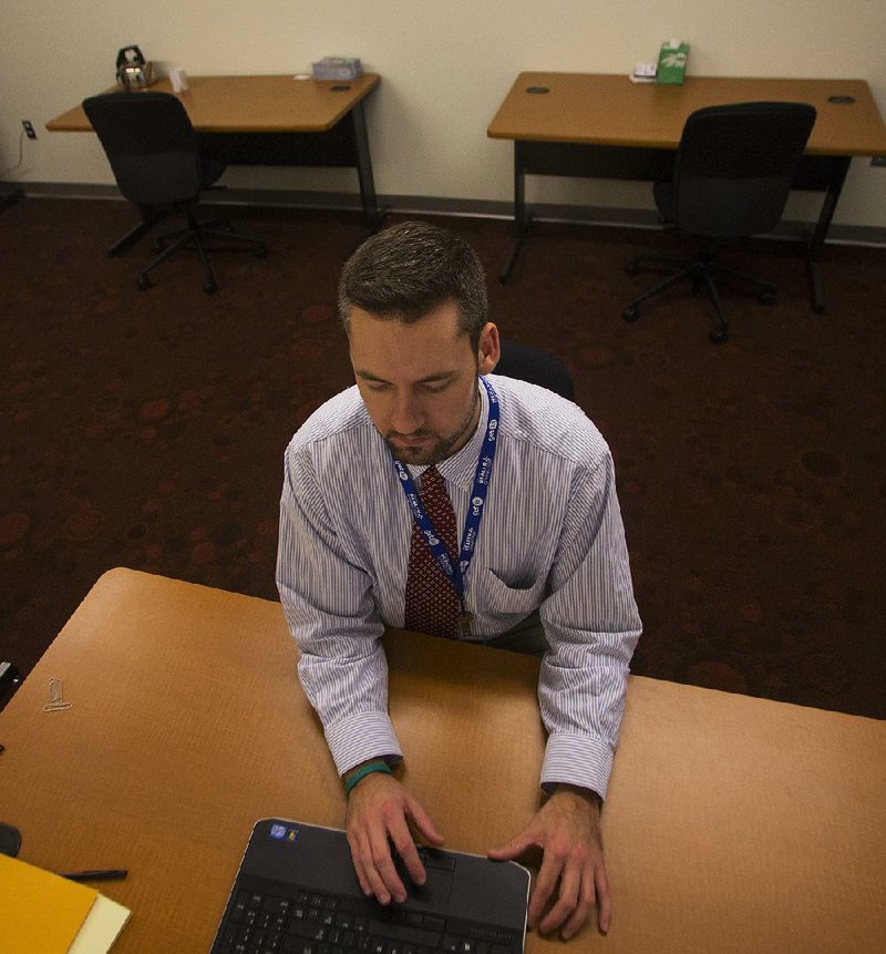 Arkansas Democrat-Gazette/MELISSA SUE GERRITS 12/02/13 - Stephen Marshall, In-Person Assister Guide with Arkansas Health Connector, prepares for individuals to sign up for Health Care at the Hillary Rodham Clinton Children's Library & Learning Center December 3, 2013. 