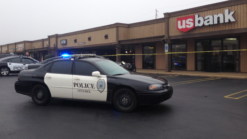 Officers work a bank robbery at the US Bank, 10720 N. Rodney Parham Road, in Little Rock on Tuesday afternoon.

