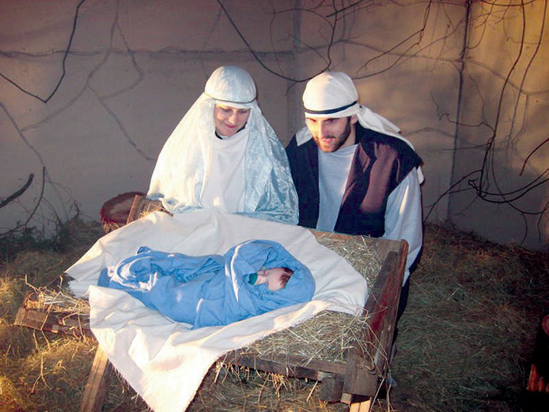 Rob and Hannah Pruitt, portraying Joseph and Mary, look at baby Jesus, Silas Muncy, in the 2008 Walk Through Bethlehem in Hector. This year’s free outdoor production will start at 6:30 p.m. Friday at Hector First Assembly of God, 11421 Arkansas 27.