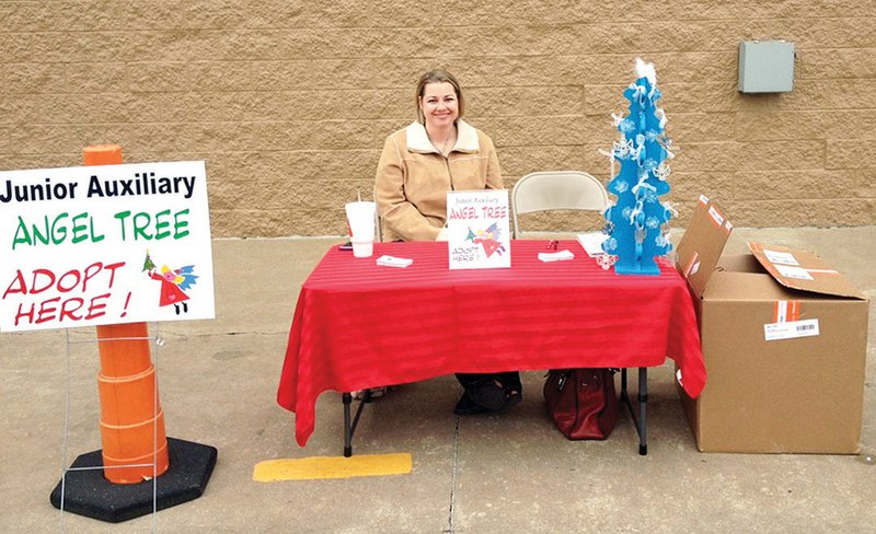 Christina Pinner, a member of the Junior Auxiliary of Searcy, tends to an Angel Tree booth in Searcy. As of Nov. 26, there were 56 angels that still needed to be adopted. Items for the angels from the tree need to turned in by Dec. 12.