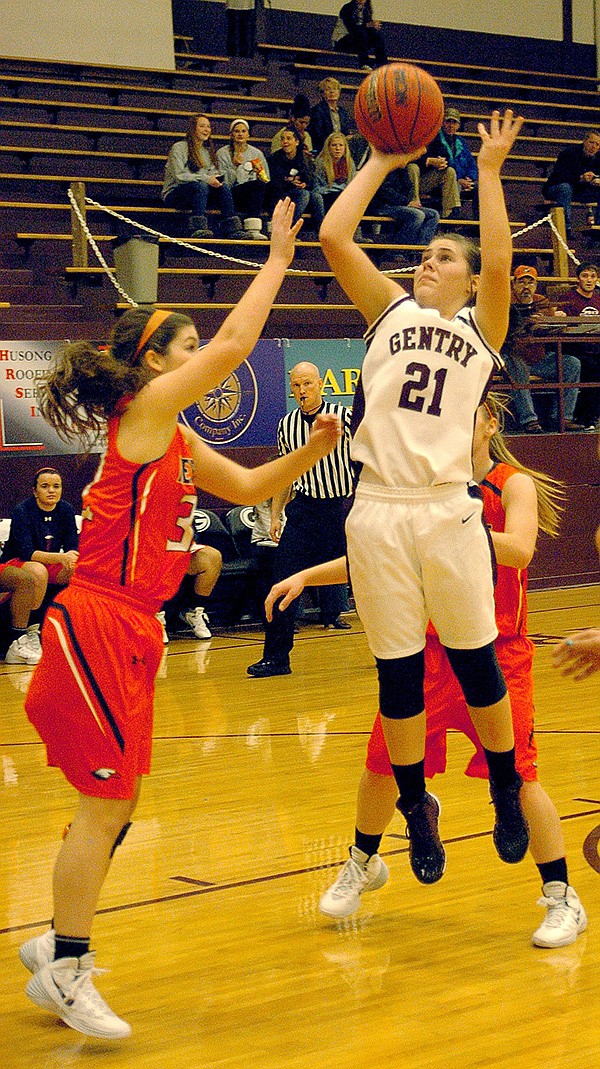 Photo by Randy Moll 
Karoline Page, Gentry senior and guard for the Lady Pioneers, makes a jump shot during play against Rogers Heritage on Tuesday, Nov. 21, in Gentry.