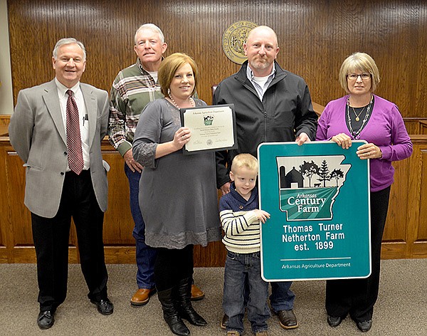 Submitted Photo 
Whitny Haley, her husband Pat and son Garrett, along with her parents, Leon and Beverly Whiteside, are pictured with Butch Calhoun, secretary of the Arkansas Agriculture Department, after receiving a Century Farms certifi cate and sign on Nov. 19.