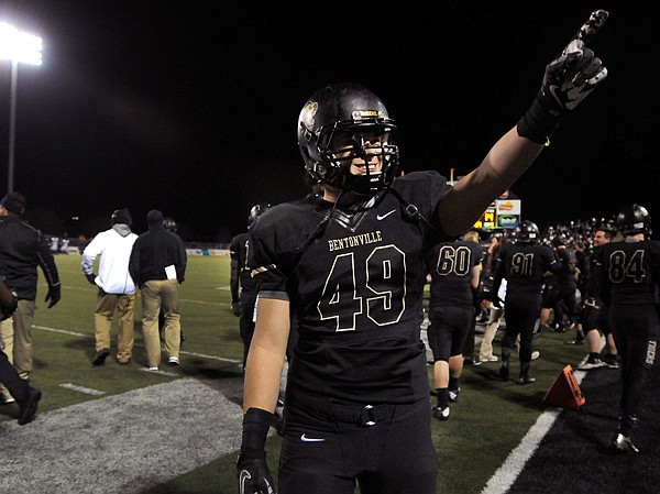 Bentonville's Colton Ross celebrates after Bentonville defeated Conway in the 7A playoffs game in Bentonville's Tiger Stadium on Friday November 29, 2013.