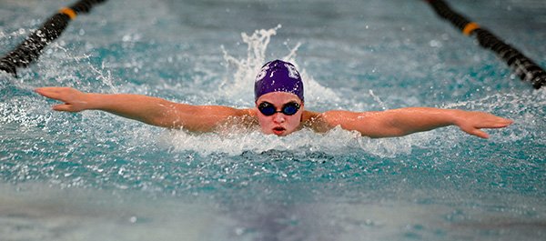 STAFF PHOTOS SAMANTHA BAKER 
• @NWASAMANTHA 
Kaley Todd of Fayetteville swims in the 200 Individual Medley on Wednesday at the Jones Center in Springdale.