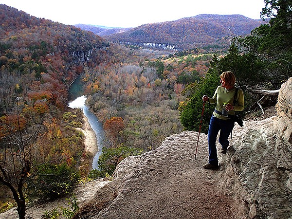 STAFF PHOTOS FLIP PUTTHOFF 
Unspoiled splendor of the Buffalo National River unfolds before Annette Rowe of Gentry on Nov. 9 during a hike along the Goat Trail. The out-and-back route is one of the most spectacular hikes in the Ozarks. To see a photo gallery of the Goat Trail hike, visit www.nwaonline.com/photos/galleries.