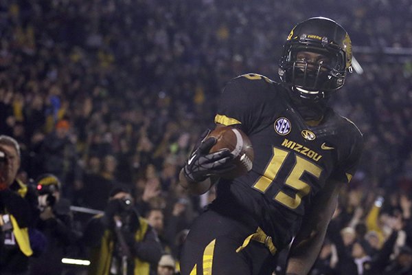 Missouri wide receiver Dorial Green-Beckham, front, celebrates after catching a a 38-yard touchdown pass during the second quarter of an NCAA college football game on Saturday, Nov. 30, 2013, in Columbia, Mo. (AP Photo/Jeff Roberson)