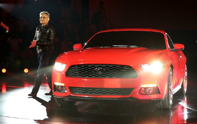 Kumar Galhotra, vice president of engineering and global product development at Ford Motor Co., describes the newly designed 2015 Ford Mustang on Thursday in Shanghai. 