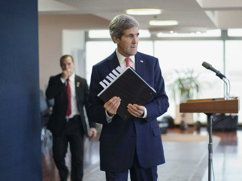 U.S. Secretary of State John Kerry gets ready to leave after answering reporters’ questions before his departure Friday from Ben Gurion International Airport in Tel Aviv. 