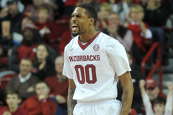 Arkansas guard Rashad Madden celebrates after hitting a 3-point shot against Clemson in the first half of Saturday afternoon's game against the Tigers at Bud Walton Arena in Fayetteville.