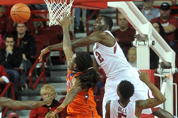 Arkansas forward Alandise Harris blocks the shot of Clemson guard Rod Hall in the first half of Saturday afternoon's game against the Tigers at Bud Walton Arena in Fayetteville.