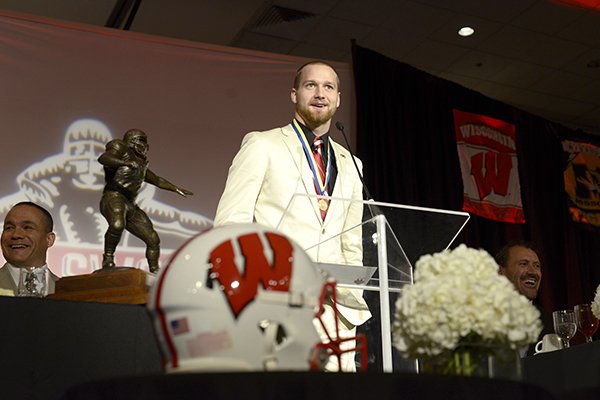 Jared Abbrederis, senior wide receiver for the University of Wisconsin, accepts the Burlsworth Trophy Monday, Dec. 9, 2013 during the trophy ceremony at the Northwest Convention Center in Springdale. The award, presented by the Springdale Rotary Club, is given an outstanding college football player who started as a walk-on.