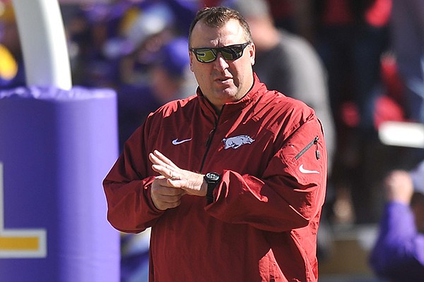 Arkansas coach Bret Bielema stands on the field prior to a Nov. 29, 2013 game against LSU at Tiger Stadium in Baton Rouge, La. 