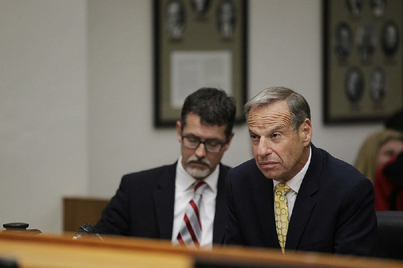 Former San Diego Mayor Bob Filner, right,  sits with Earll Pott, a member of his defense team, in Robert J. Trentacosta's Superior Courtroom on Monday, Dec. 9, 2013 in San Diego.  Filner was sentenced Monday to three months of home confinement and three years of probation for harassing women while he was mayor of San Diego.  Filner, 71, who resigned amid widespread allegations of sexual harassment, pleaded guilty in October to one felony and two misdemeanors for placing a woman in a headlock, kissing another woman and grabbing the buttocks of a third.  Trentacosta’s sentence was the same as what prosecutors recommended in a plea agreement with Filner. (AP Photo/U-T San Diego,  John Gastaldo, Pool)