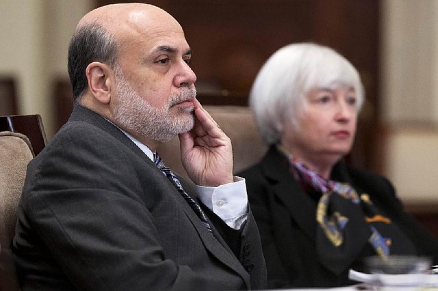 Ben Bernanke, chairman of the Federal Reserve (left), and Janet Yellen, vice chairman, attend a meeting of the Board of Governors of the Federal Reserve in Washington, D.C., on Tuesday. 