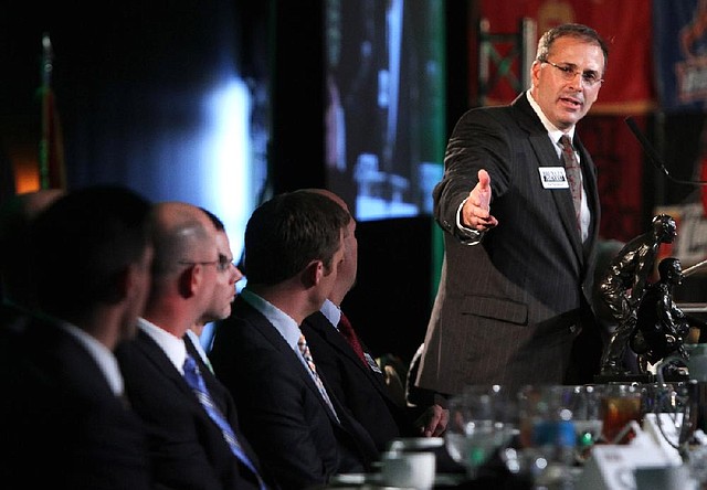 Michigan State defensive coordinator Pat Narduzzi, named the winner of the Broyles Award on Tuesday, acknowledges the other five finalists at the Marriott Hotel banquet. 