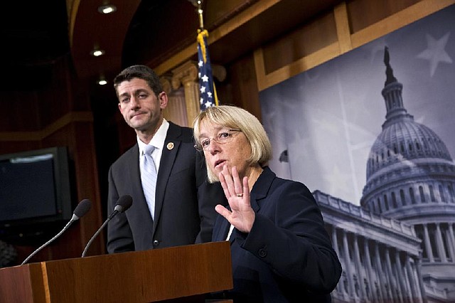 Republican Sen. Paul Ryan of Wisconsin and Democratic Sen. Patty Murray of Washington announce a tentative budget agreement Tuesday that Murray said broke through “the partisanship and gridlock.” Ryan said the plan “cuts spending in a smarter way.” 