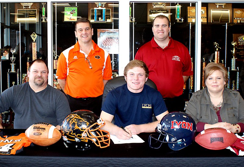 Photo by Dodie Evans Cody Robinson signs with Lyon College in Batesville....
