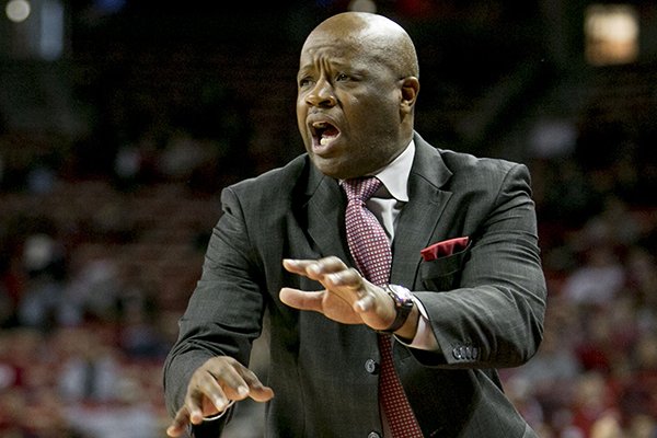 Arkansas head coach Mike Anderson yells to the referee during the first half of a NCAA college basketball game against Clemson Saturday, Dec. 7, 2013, at Bud Walton Arena in Fayetteville, Ark. (AP Photo/Gareth Patterson)