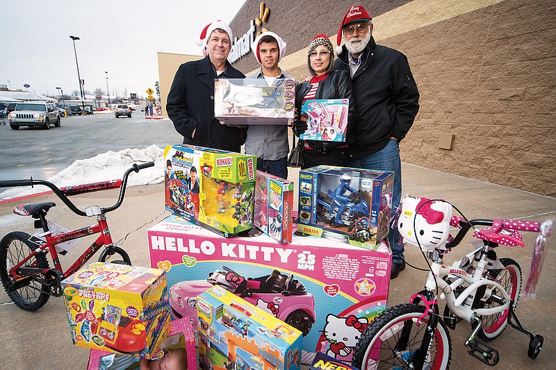 From the left, Rick Meter, Brandt Ballew, Tammy Ballew and James Ballew are part of the 2013 Toy Troopers toy drive that will be held Friday, Saturday and Sunday at the Walmart Supercenter parking lot in Bryant.