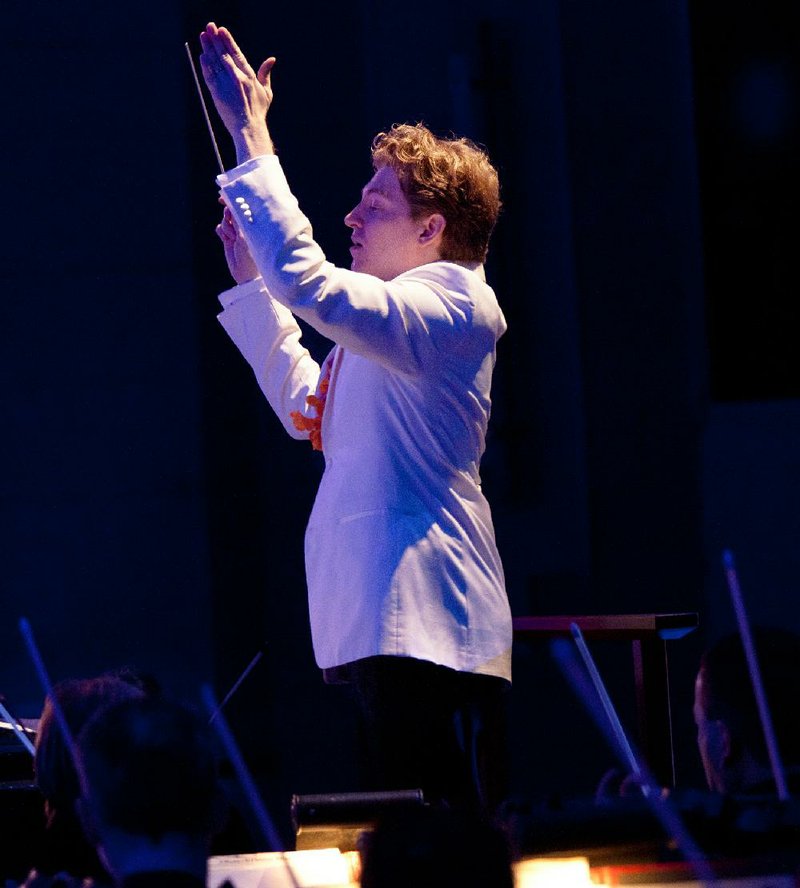 The Arkansas Symphony Orchestra gets whimsical, warm and fuzzy for its annual Christmas extravaganza. Philip Mann is shown conducting in this file photo.