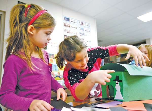   STAFF PHOTO JASON IVESTER 
Abigail Silvia, left, 6, and Katy Bauer, 6, both Apple Glen Elementary School first-graders, work on their art project during Adventure Club.