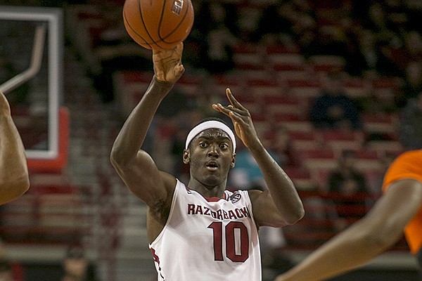 Arkansas forward Bobby Portis, 10, lobs the ball down the court during the second half of a NCAA college basketball game against Savannah State Thursday, Dec. 12, 2013 at Bud Walton Arena in Fayetteville, Ark. Arkansas defeated Savannah State 72-43. (AP Photo/Gareth Patterson)