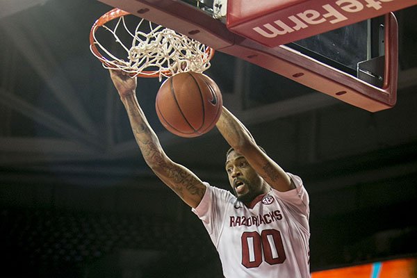 Arkansas guard Rashad Madden, (00), dunks the ball during the first half of a NCAA college basketball game against Savannah State, Thursday, Dec. 12, 2013 at Bud Walton Arena in Fayetteville, Ark. (AP Photo/Gareth Patterson)