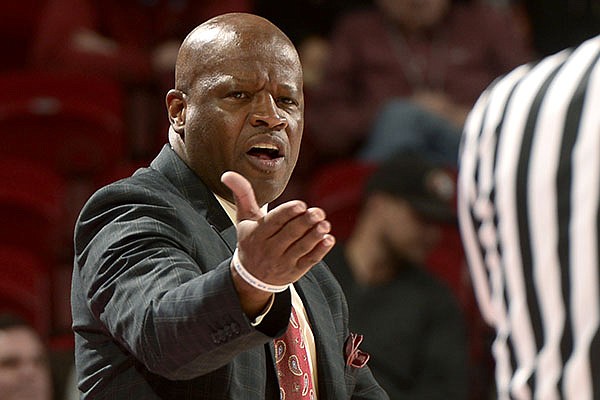 Arkansas head coach Mike Anderson argues a call against the Razorbacks Thursday Dec. 12, 2013 with an official in the first half at Bud Walton Arena in Fayetteville.