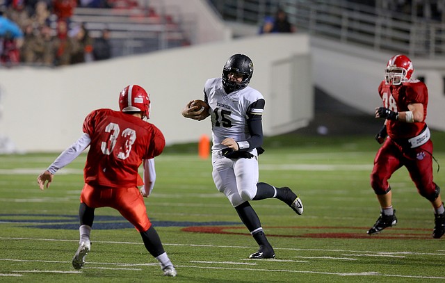 Bentonville's QB Kasey Ford, scrambles upfield for a first down in the first half during their class 7A championship game Friday night at War Memorial Stadium in Little Rock.