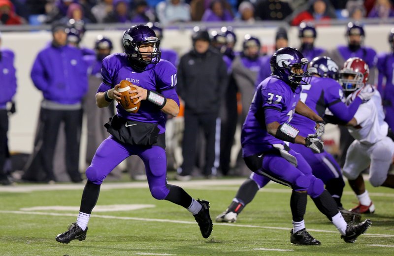 El Dorado's QB Clayton Waldrum scrambles during their victory over Pine Bluff at their class 6A state football championship game Saturday in Little Rock.