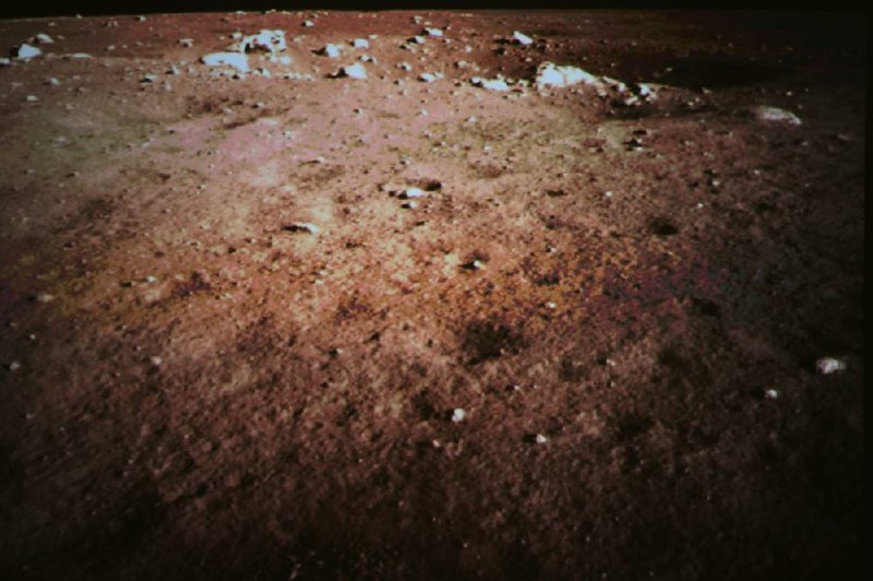 The surface of the moon recedes into darkness in this photo taken by the onboard camera of China’s lunar probe Chang-e 3 and released Saturday by China’s Xinhua News Agency. 