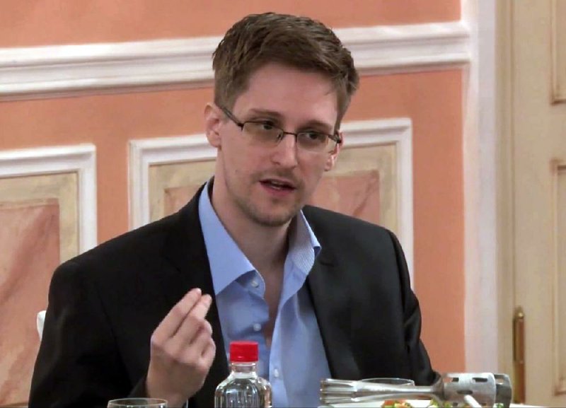 In this file image made from video released by WikiLeaks on Friday, Oct. 11, 2013, former National Security Agency systems analyst Edward Snowden speaks during a presentation ceremony for the Sam Adams Award in Moscow.