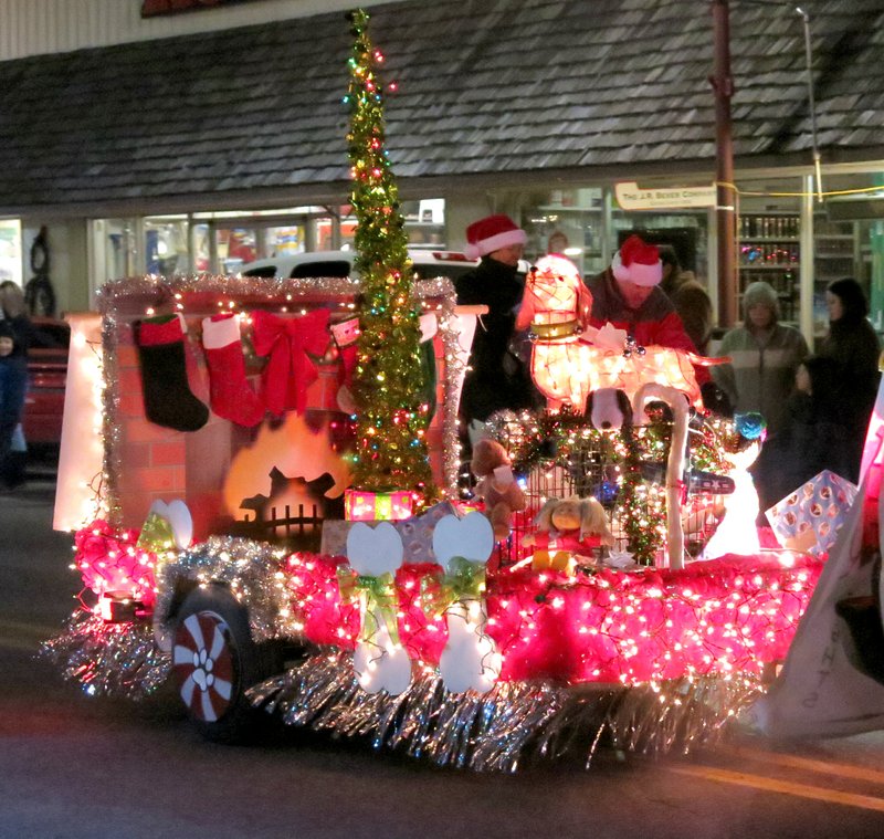 Photos by Randy Moll This colorful float by Marcy s Grooming and Boarding was a favorite among parade watchers on Saturday in Gentry. It received an award for the best use of lights.