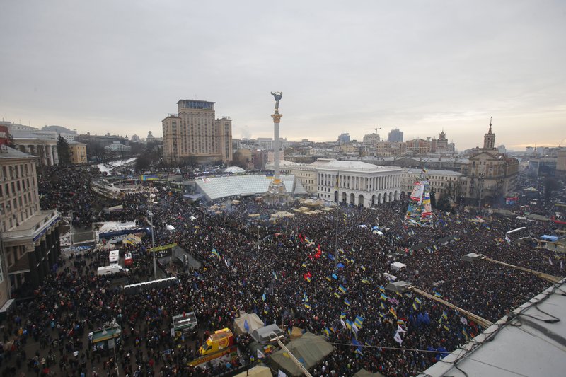 Pro-European Union activists gather during a rally in Independence Square in Kiev, Ukraine, Sunday, Dec. 15, 2013. About 200,000 anti-government demonstrators converged on the central square of Ukraine’s capital Sunday, a dramatic demonstration that the opposition’s morale remains strong after nearly four weeks of daily protests. (AP Photo/Sergei Grits)