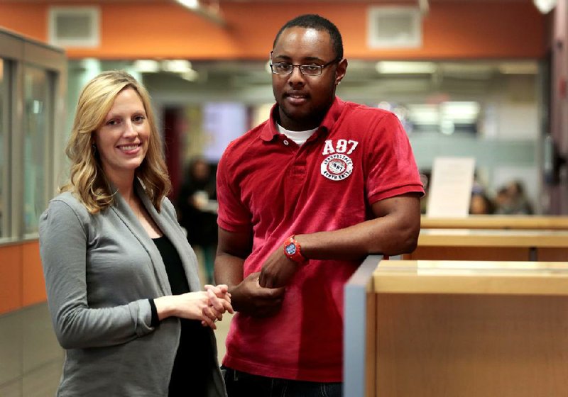 NWA Media/JASON IVESTER --12-13-2013--
Leslie Yingling, director of collegiate access initiative and diversity affairs outreach, and Raheem Morris, freshman and KIPP alum; photographed on Friday, Dec. 13, 2013, inside the Center for Multicultrual and Diversity Education on the Fayetteville campus of the University of Arkansas