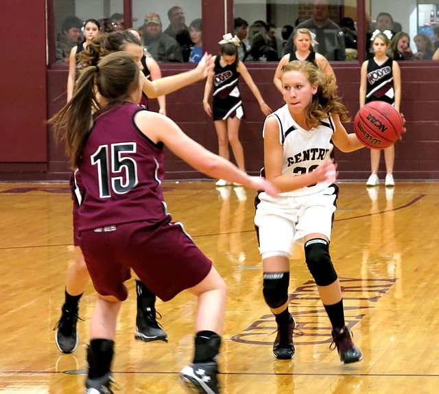 Photo by Randy Moll Surrounded by Lady Wolves, Gentry sophomore, Mallory Morris, had to work hard to bring the ball down court in play against Lincoln on Monday at Gentry High School. Gentry lost the game, 29-26, and had opportunity to catch up in the final moments but weren t able to cash in on the opportunity. Boys game final results were not yet available at press time. Results will be published when made available.