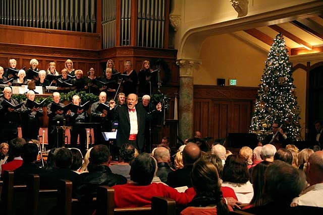 Ron Hall directs the congregation in singing “O Come, All Ye Faithful” to begin Gloria!, a Christmas celebration concert, at First United Methodist Church on Sunday. The concert featured both the adult and children’s choirs, orchestra and handbells.