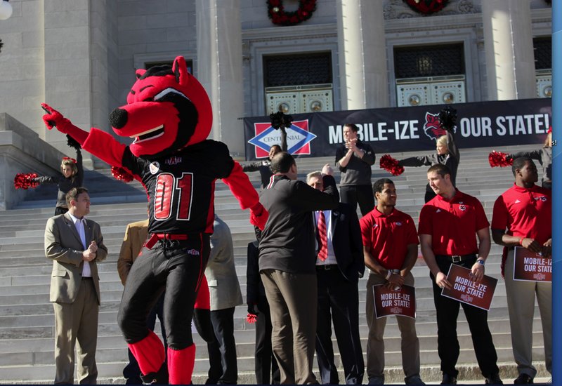 The Arkansas State University's Red Wolves mascot dances on the Capitol building's front steps during a pep rally for the football team on Monday, Dec. 16, 2013. The Red Wolves will play in the GoDaddy.com Bowl against Ball State University's Cardinals in Mobile, Ala. on Jan. 5.