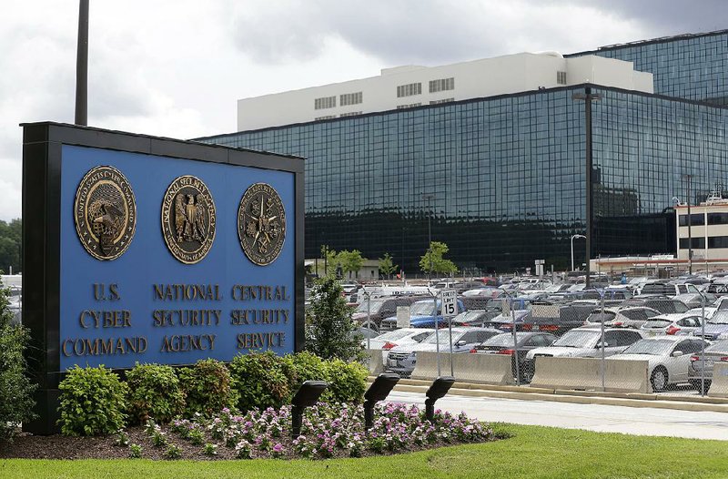 FILE - This June 6, 2013 file photo shows a sign outside the National Security Agency (NSA) campus in Fort Meade, Md. A federal judge says the NSA's bulk collection of phone records violates the Constitution's ban on unreasonable searches. The judge put his decision on hold pending a nearly certain government appeal. (AP Photo/Patrick Semansky, File)