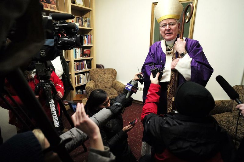 Archbishop John Nienstedt, head of the Archdiocese of St. Paul and Minneapolis, talks to the media Sunday at Our Lady of Grace Church in Edina, Minn. Nienstedt, in a letter posted Tuesday on the archdiocese website, says he is stepping aside from public ministry after an allegation that he touched a boy. 
