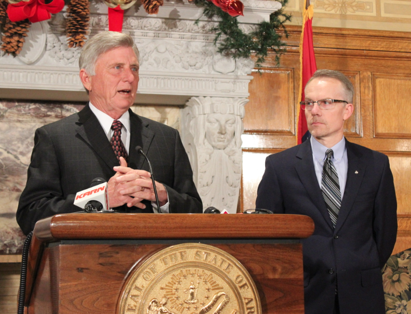 Gov. Mike Beebe speaks while John Herzog of HP looks on during a news conference Wednesday morning at the state Capitol.