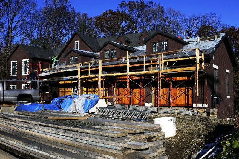 Work continues on a new house in Mount Lebanon, Pa., in November. The Commerce Department said developers started construction on houses and apartments in November at a seasonally adjusted annual rate of 1.09 million. 