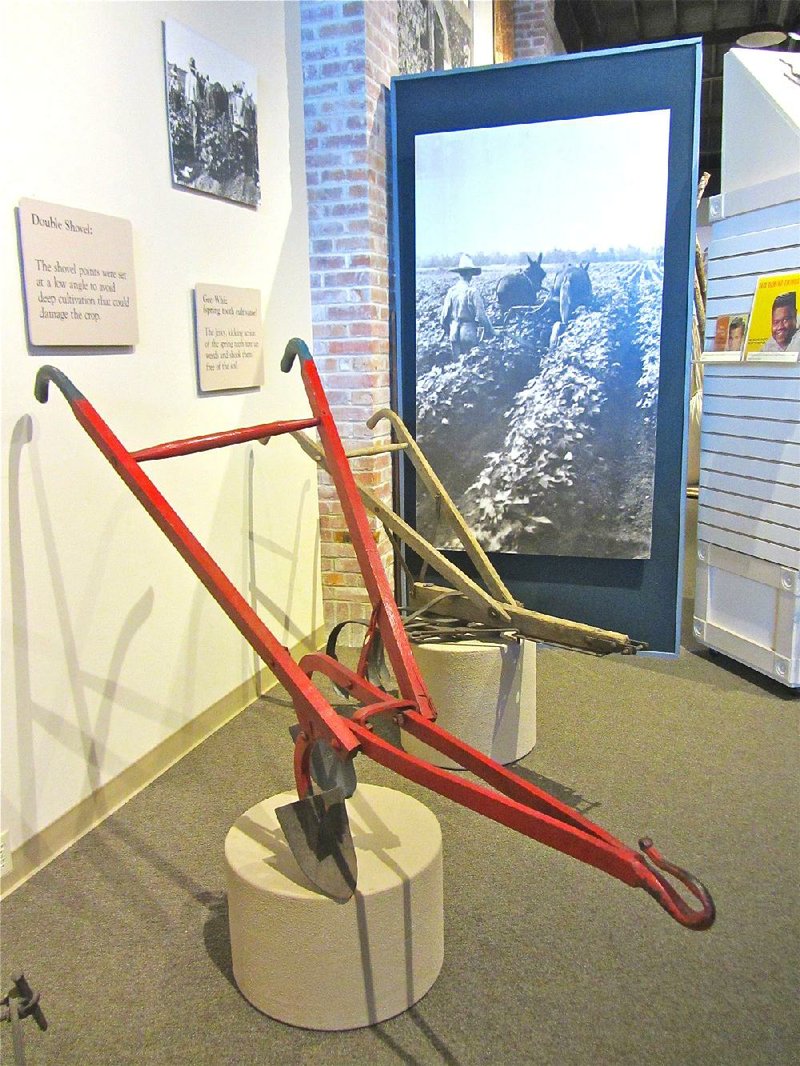 Farm implements of old on display at the Plantation Agricultural Museum include a double shovel. Drawn by mules, it was set at a low angle to avoid deep cultivation that would damage crops. 