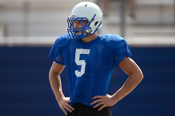 Rogers' Zack Wary waits on the sideline between drills on Monday, July 8, 2013, during the summer football camp at Rogers High School.